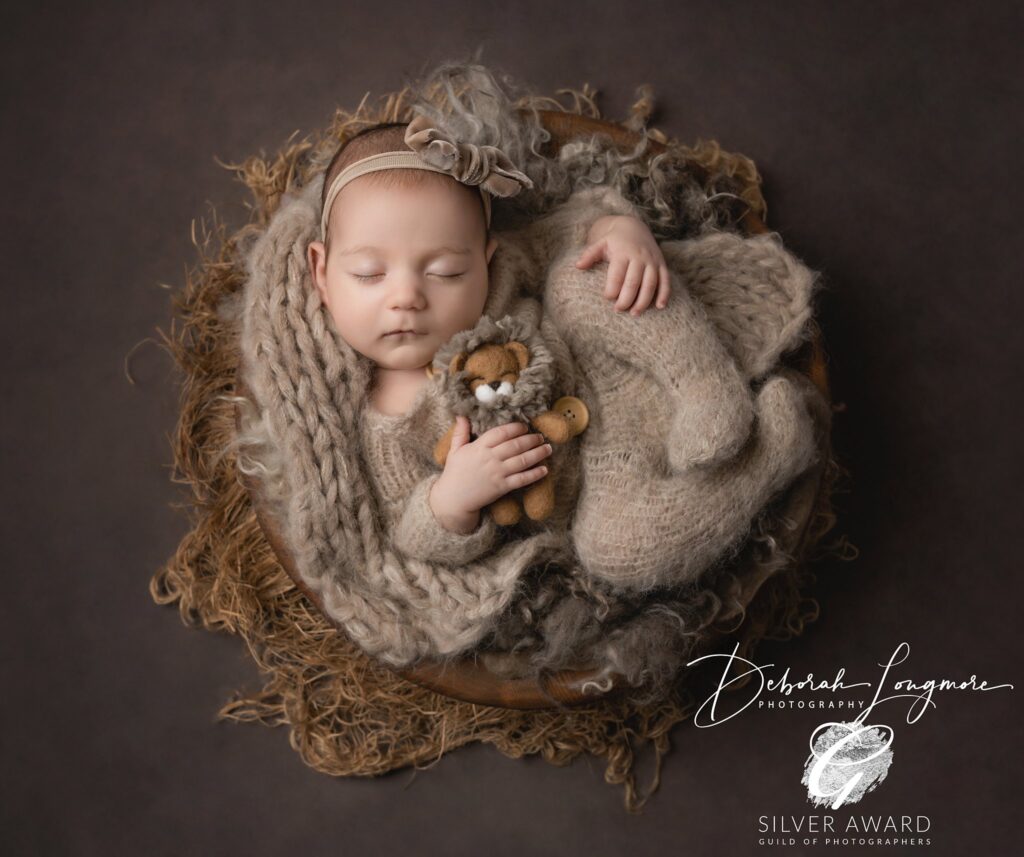 A peaceful baby sleeping safely, swaddled and posed gently by Deborah Longmore Photography.  Newborn Photography Birmingham, Newborn Photography Tamworth, Newborn Photography in Birmingham, Newborn Photography in Tamworth